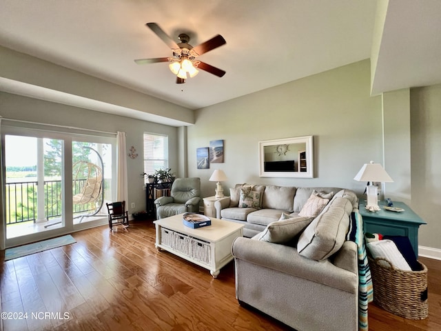 living room featuring wood-type flooring and ceiling fan