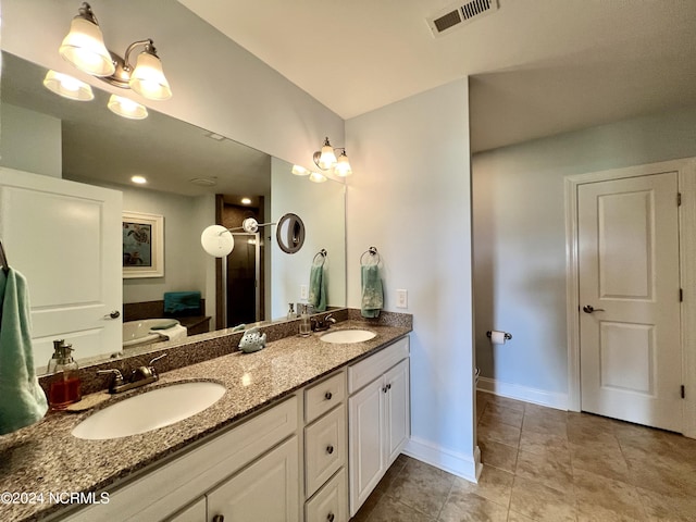 bathroom featuring vanity and tile patterned flooring