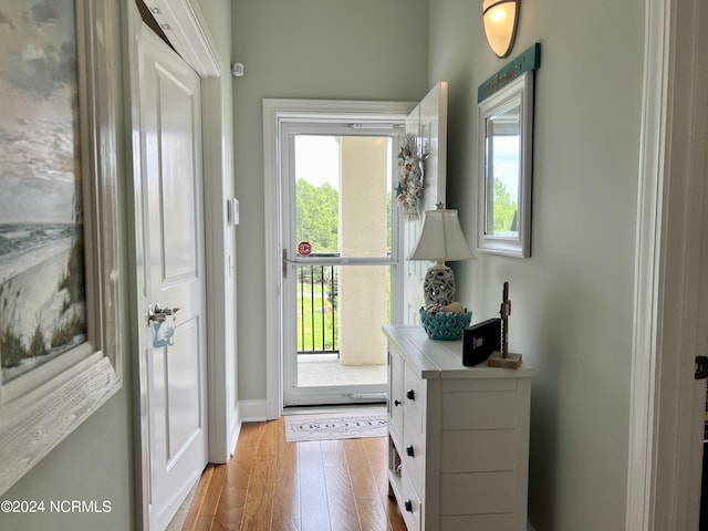 doorway to outside with hardwood / wood-style flooring