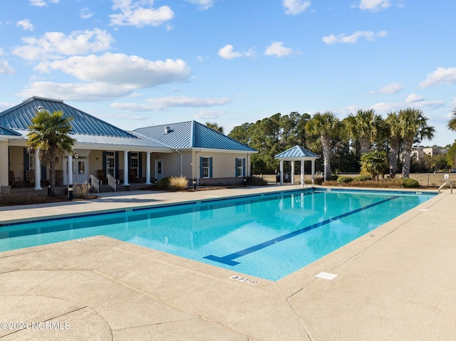 view of swimming pool featuring a gazebo and a patio area