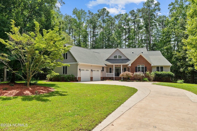 view of front of property with a garage and a front yard