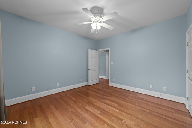 unfurnished room featuring ceiling fan and light hardwood / wood-style floors