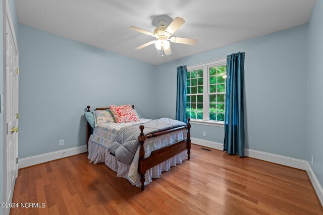 bedroom featuring ceiling fan and light hardwood / wood-style floors