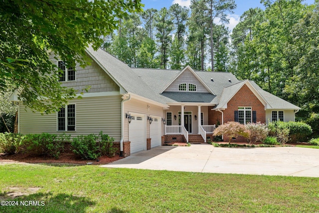 craftsman-style house featuring a front yard and a garage