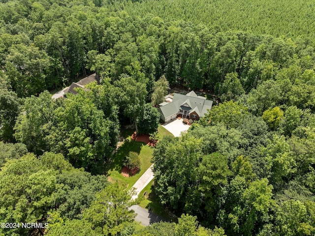 drone / aerial view featuring a view of trees