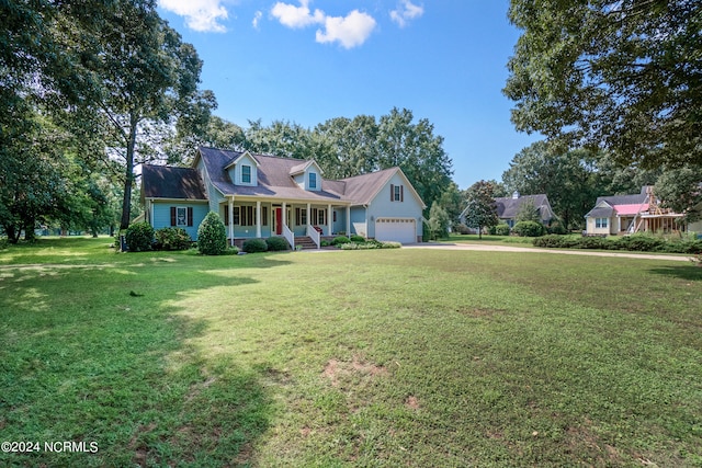 cape cod house featuring a porch, a front yard, and a garage