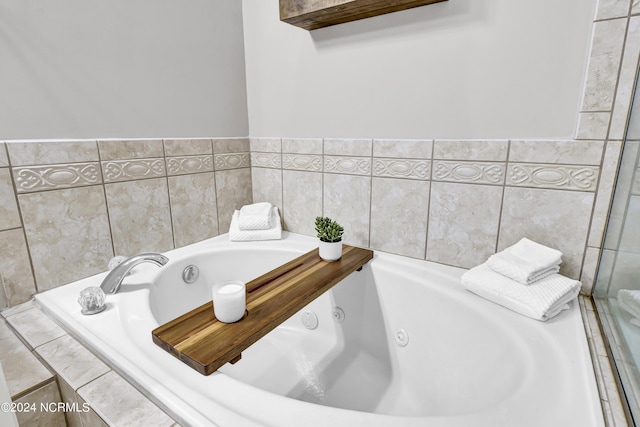 full bathroom featuring a jetted tub