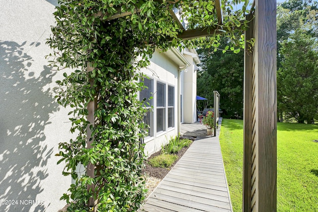 view of side of home featuring a yard