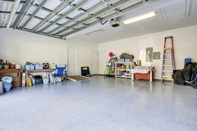 garage featuring a garage door opener and electric panel