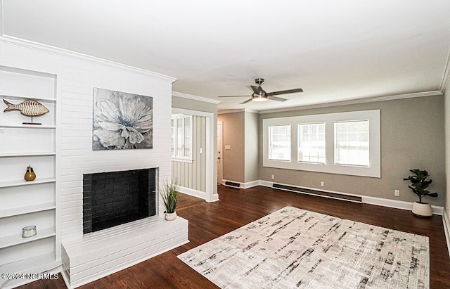 living room with dark hardwood / wood-style floors, a fireplace, baseboard heating, ornamental molding, and ceiling fan