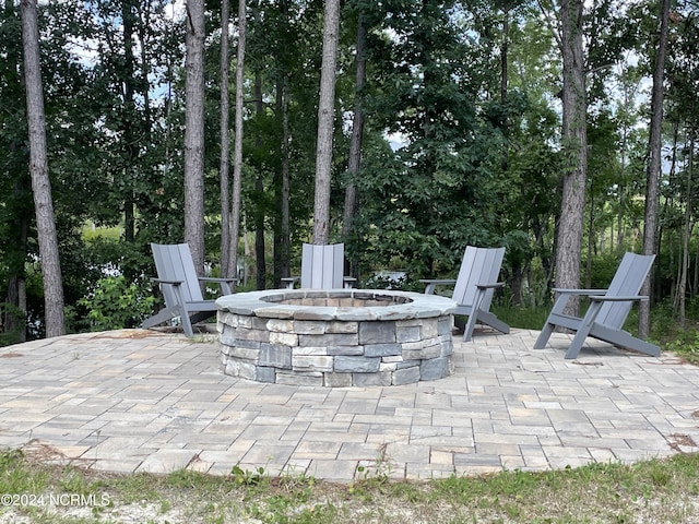 view of patio with an outdoor fire pit