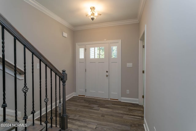 entrance foyer featuring ornamental molding and dark hardwood / wood-style flooring