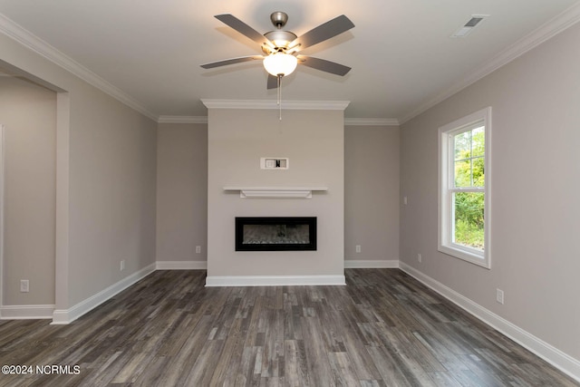 unfurnished living room with crown molding, dark wood-type flooring, and ceiling fan