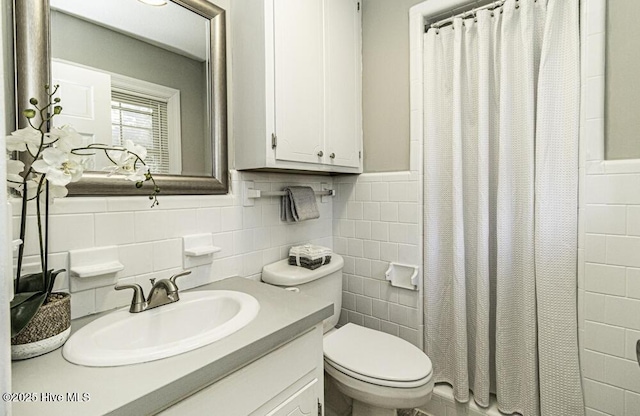 bathroom featuring vanity, toilet, tile walls, and a shower with shower curtain