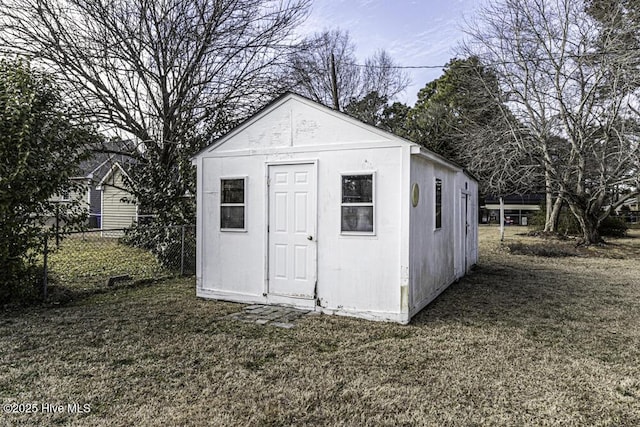 view of outdoor structure featuring a lawn