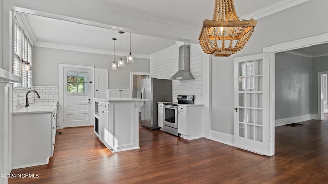 kitchen featuring dark hardwood / wood-style flooring, a center island, white cabinets, wall chimney range hood, and appliances with stainless steel finishes