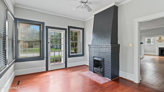 unfurnished living room featuring baseboards, a fireplace, ornamental molding, and dark wood-style flooring