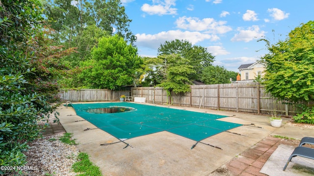 view of pool with a fenced in pool, a fenced backyard, and a patio