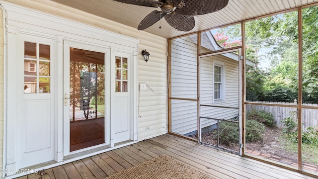 unfurnished sunroom with ceiling fan and a healthy amount of sunlight