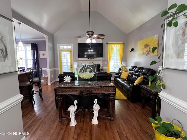 living room with ceiling fan, dark wood-type flooring, and vaulted ceiling