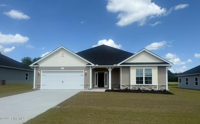 ranch-style home featuring a front yard, stone siding, concrete driveway, an attached garage, and a porch