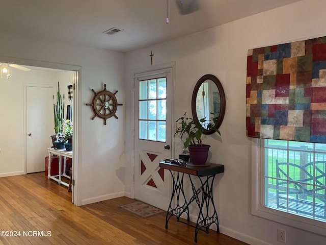 interior space with ceiling fan and hardwood / wood-style flooring