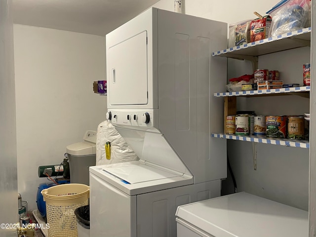 washroom with stacked washer / dryer