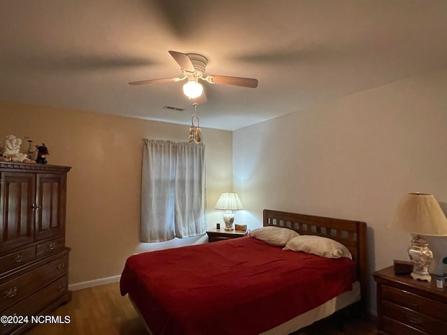 bedroom featuring ceiling fan and hardwood / wood-style flooring