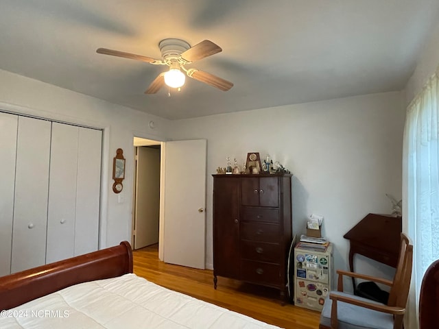 bedroom with light wood-type flooring, a closet, and ceiling fan