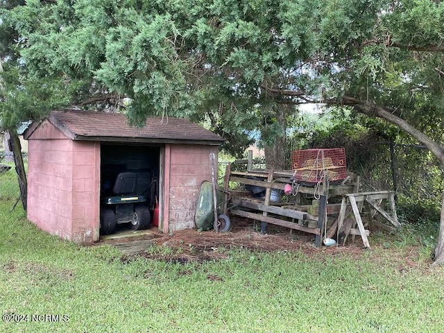 view of shed with fence