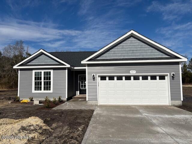 view of front of home with a garage