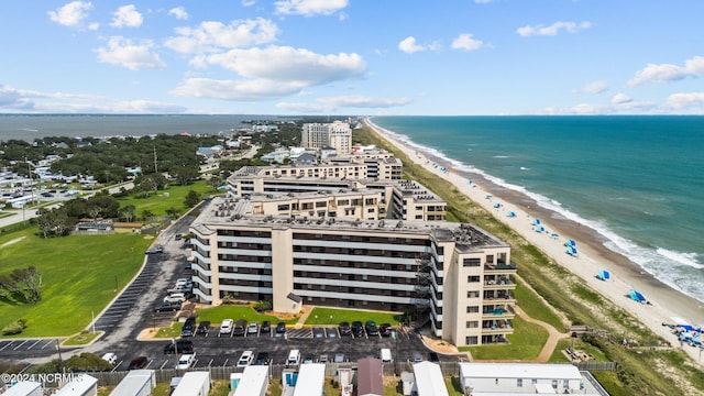 aerial view with a water view and a view of the beach