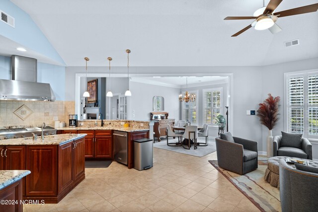 kitchen featuring lofted ceiling, pendant lighting, and plenty of natural light