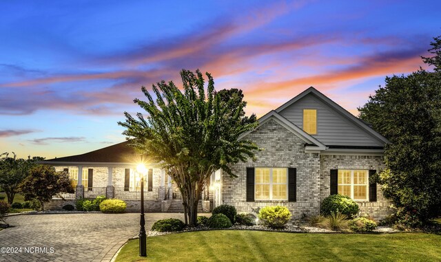 view of front of home with a lawn