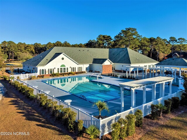 view of swimming pool featuring a patio area