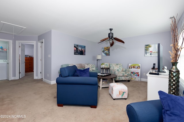 carpeted living room featuring ceiling fan