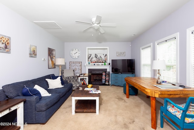 carpeted living room featuring ceiling fan