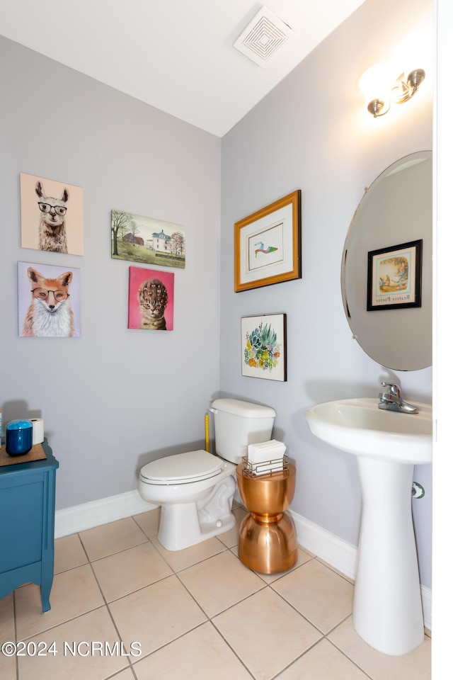 bathroom featuring tile patterned floors and toilet