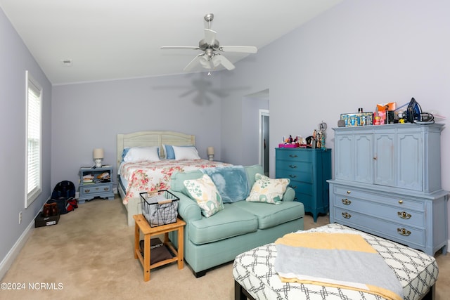 carpeted bedroom with lofted ceiling