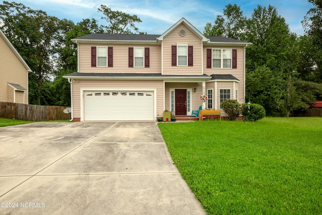 view of front facade featuring a garage and a front lawn