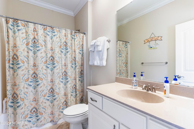 bathroom with tile patterned flooring, toilet, vanity, and crown molding