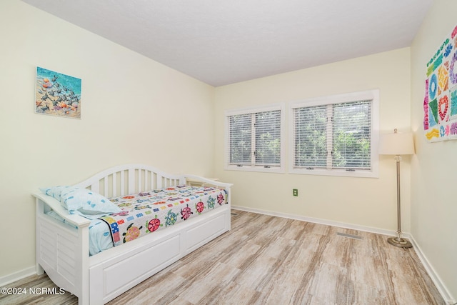 bedroom featuring light wood-type flooring