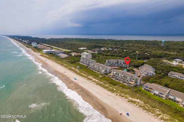 birds eye view of property featuring a water view and a view of the beach