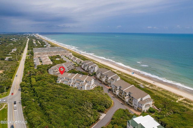 drone / aerial view with a water view and a view of the beach