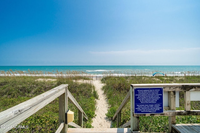 property view of water featuring a beach view