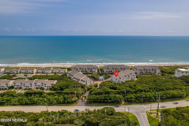 aerial view with a water view and a beach view