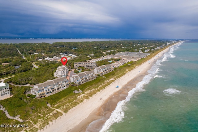 drone / aerial view featuring a view of the beach and a water view