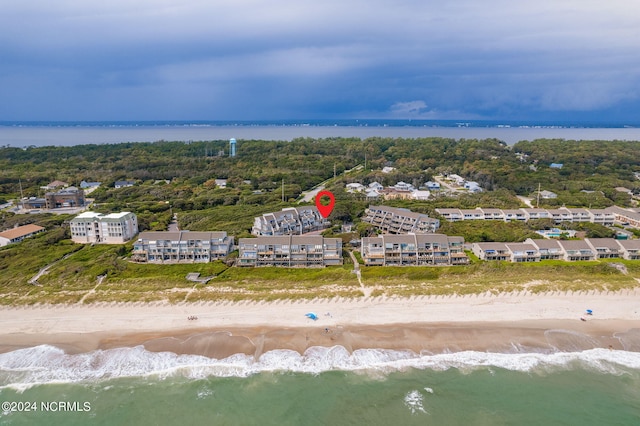 aerial view featuring a water view and a beach view