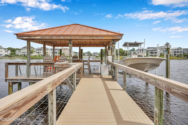 view of dock featuring a water view and boat lift