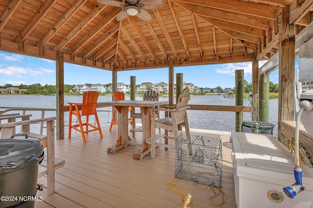 view of dock featuring a gazebo and a water view